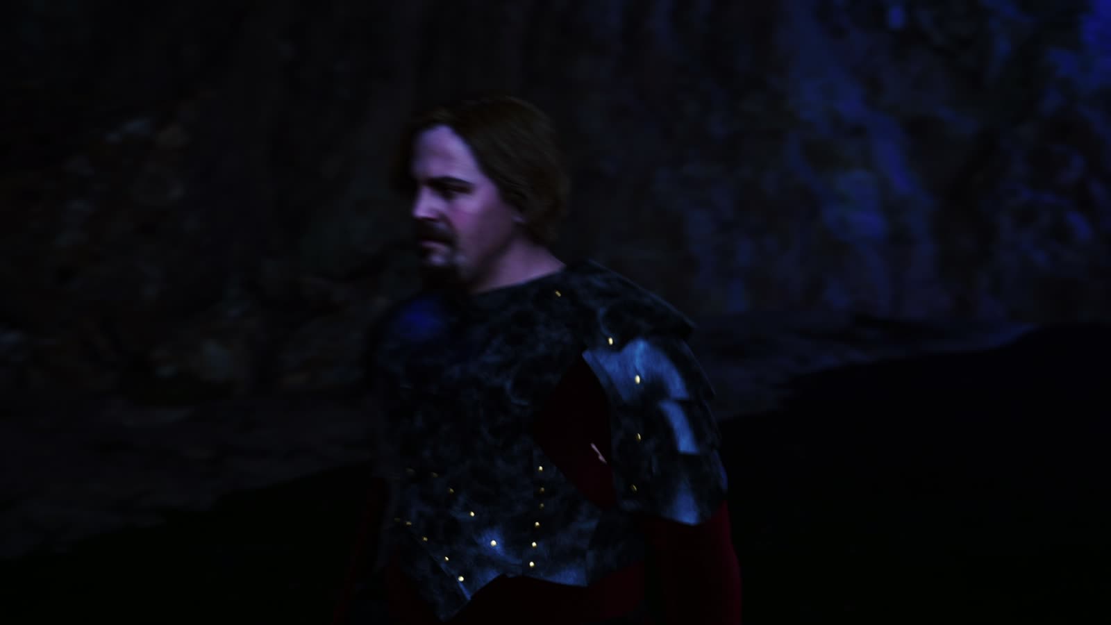 Knight in gleaming armour inside a cave
