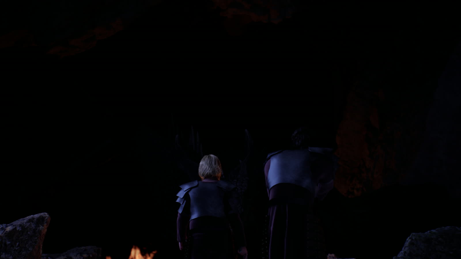 Figures in low light inside a cavern